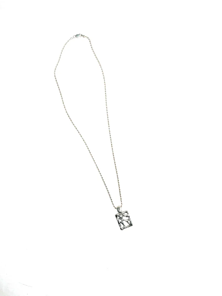 Elegant silver necklace with a rectangular pendant.